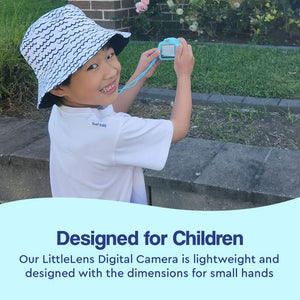 Child holding a blue LittleLens Kids Camera outdoors, smiling and wearing a white bucket hat, designed lightweight for small hands.