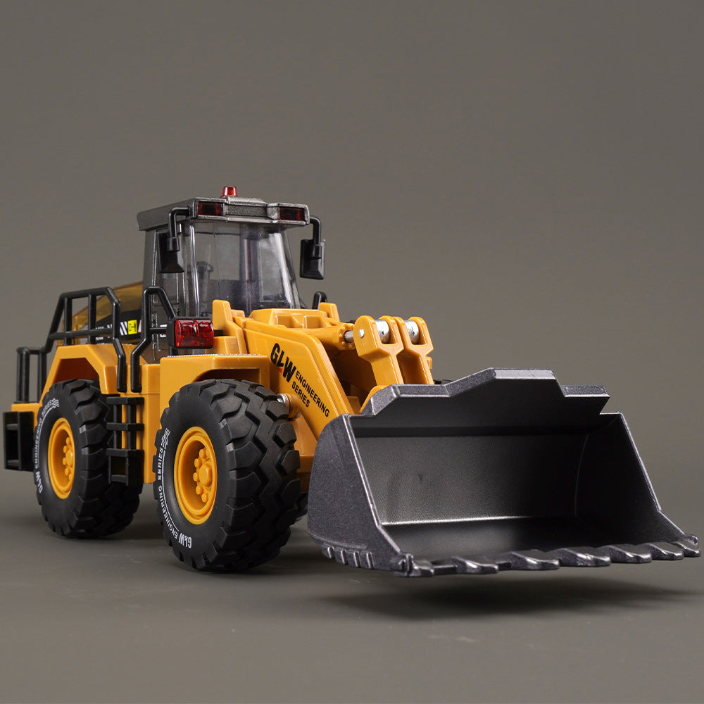 Yellow alloy engineering vehicle toy loader with black bucket and large tires for kids play