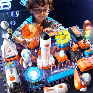 Child playing with STEM electronic building blocks set featuring rockets, astronauts, and scientific components